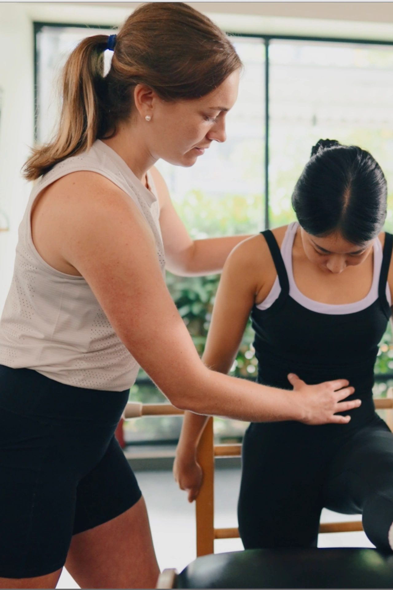 Carol Teaching Pilates to Hana on the Gratz Ladder Barrel